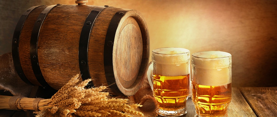 Beer barrel with beer glasses on table on brown background